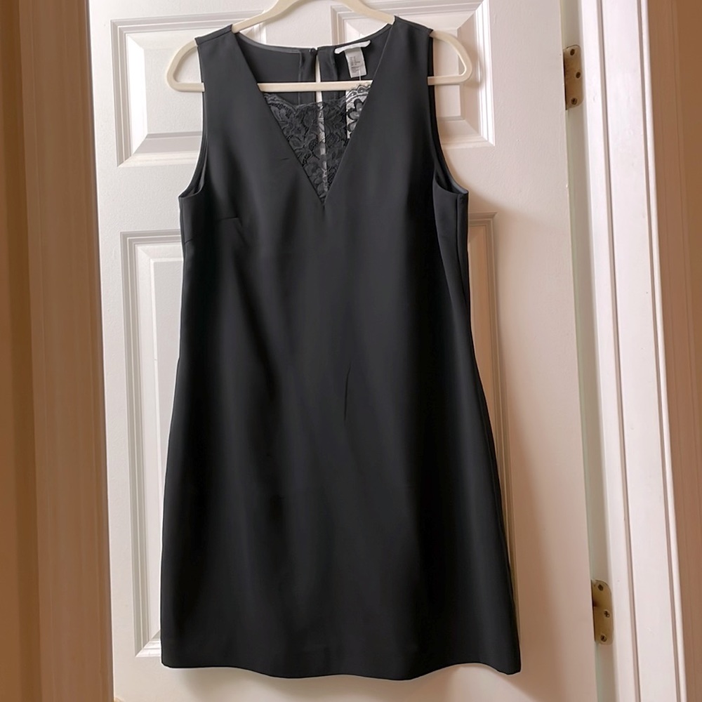 H&M New Black front lace dress. Size 12 above the knee length